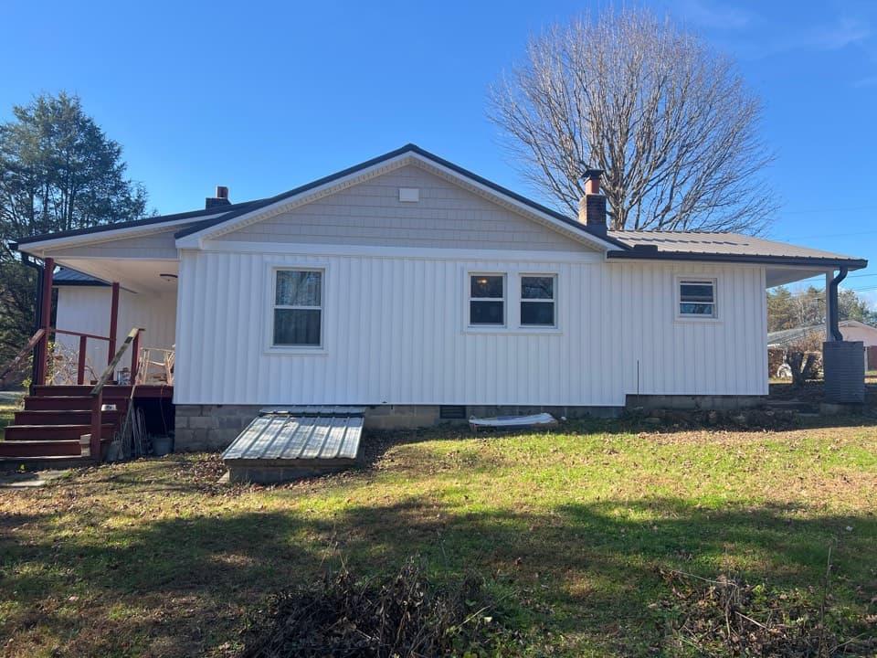 Metal panel roof, board n batten and gutters, Clinton