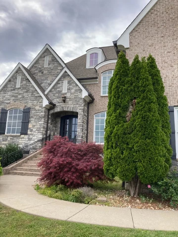 Stone and brick home in Franklin, job photo: roof leak repair quote