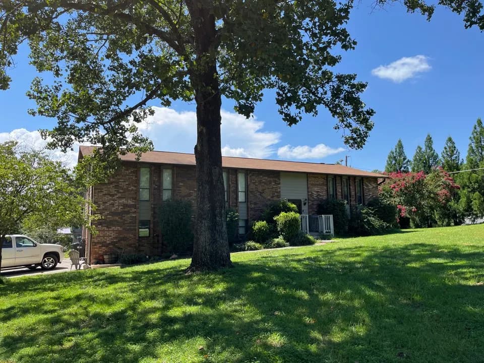Home in Clinton job photo: giving a free estimate for a roof repair