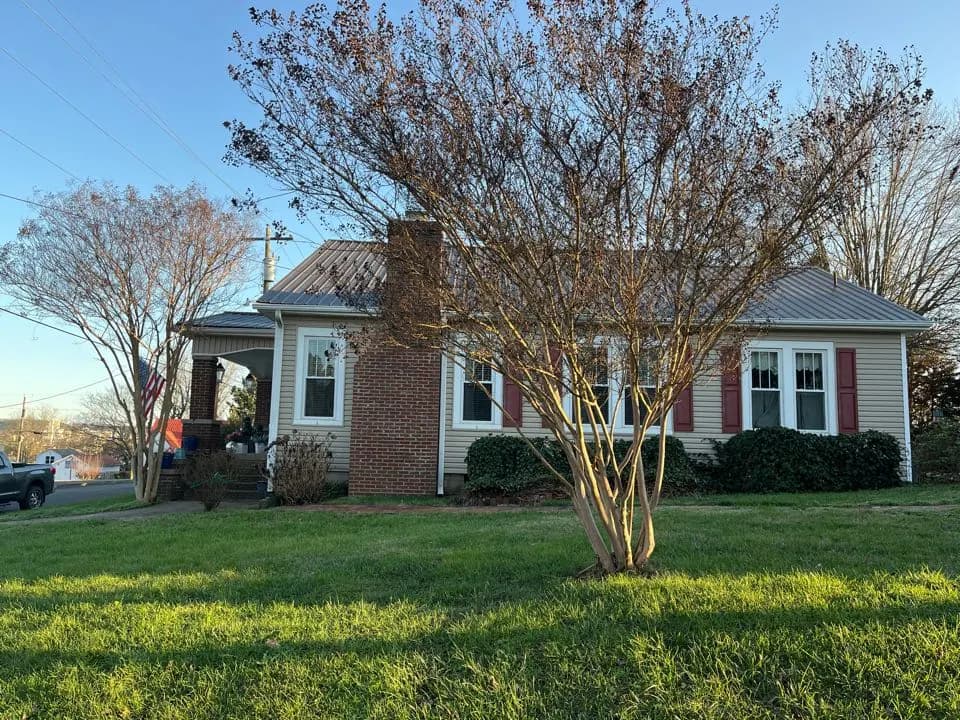 Metal roof repair on a home in Loudon by the Mobley Brothers Knoxville team