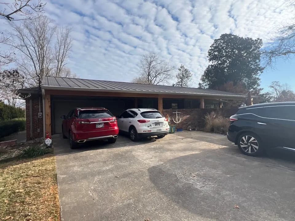 Standing seam metal roof installation by Mobley Brothers on a home in Maryville