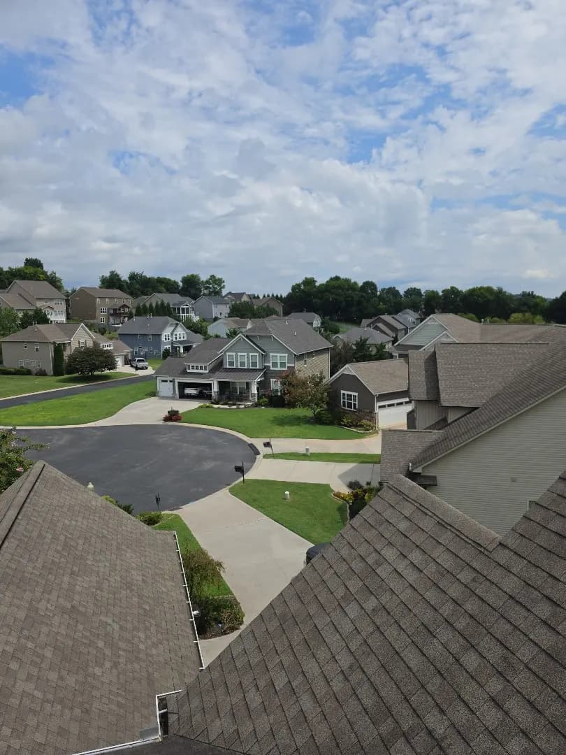 View from a roof during a storm damage inspection in Farragut, looking out over a neighborhood