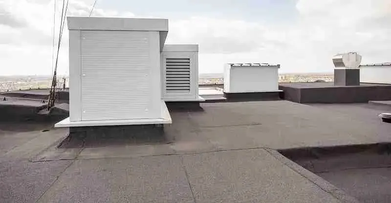 Flat commercial roof surface with rooftop mechanical units