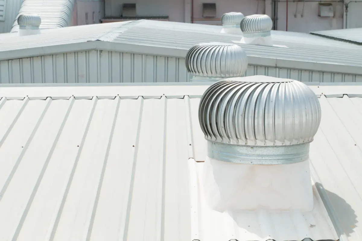 Turbine vents on a white metal commercial roof