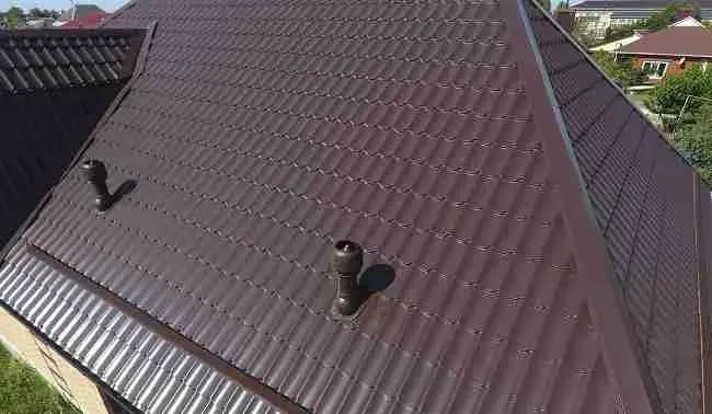 Brown metal roof with vent pipes