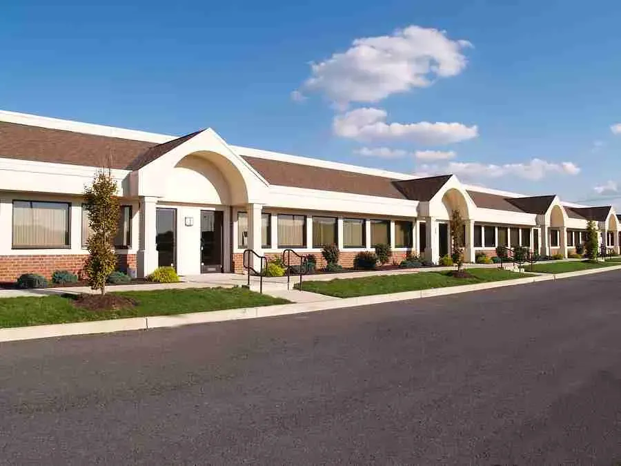 Single-story commercial office building with a shingle roof