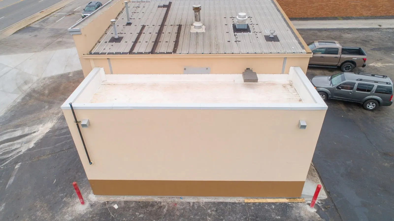 Aerial view of the rear of a Valvoline store with a low-slope roof