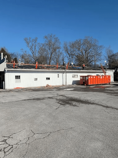 Commercial roof being repaired - Let our certified roofers handle your commercial roof repairs in Knoxville. Schedule with Mobley Brothers Roofing and Renovation LLC today.