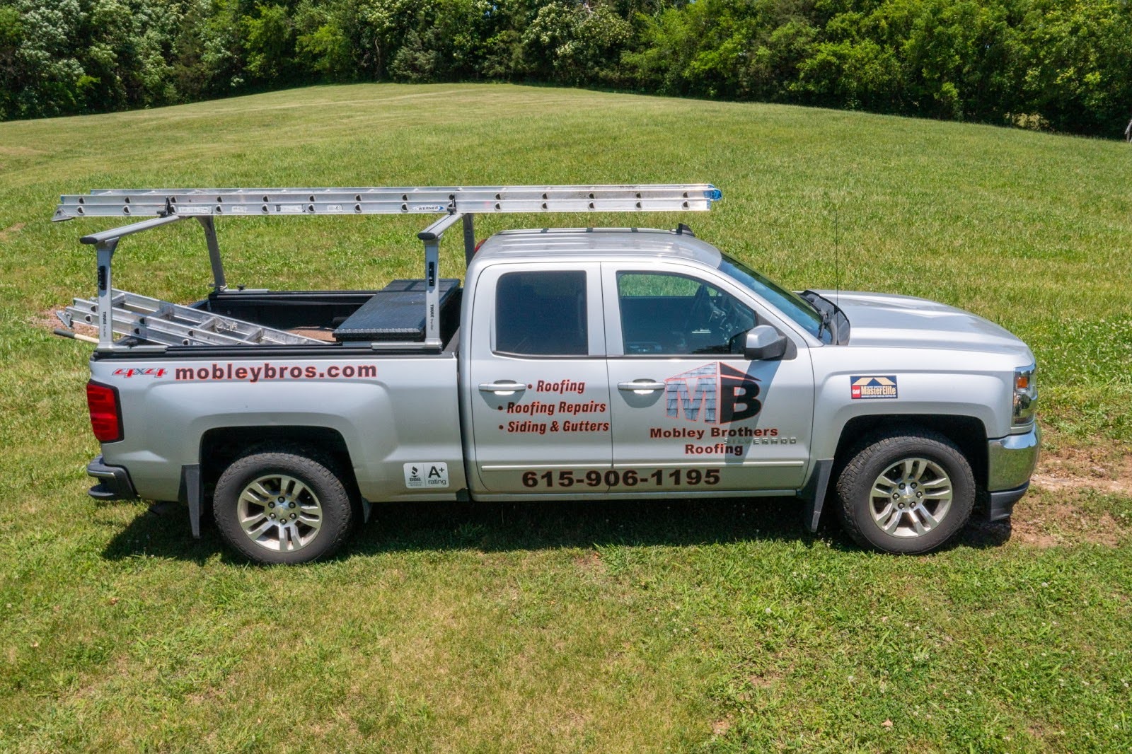 Mobley Brothers truck - For more information on commercial roof maintenance in Lebanon, call us at (615) 906-1195.