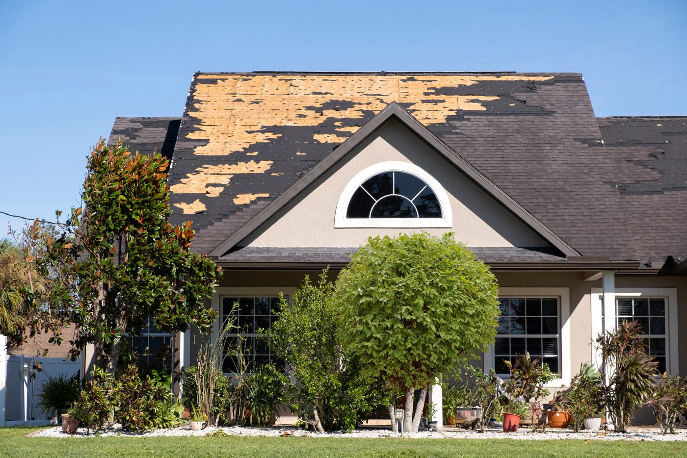 Old roofing being torn off a home