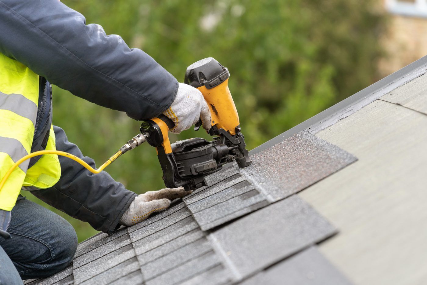 Mobley Brothers technician installing new roofing shingles